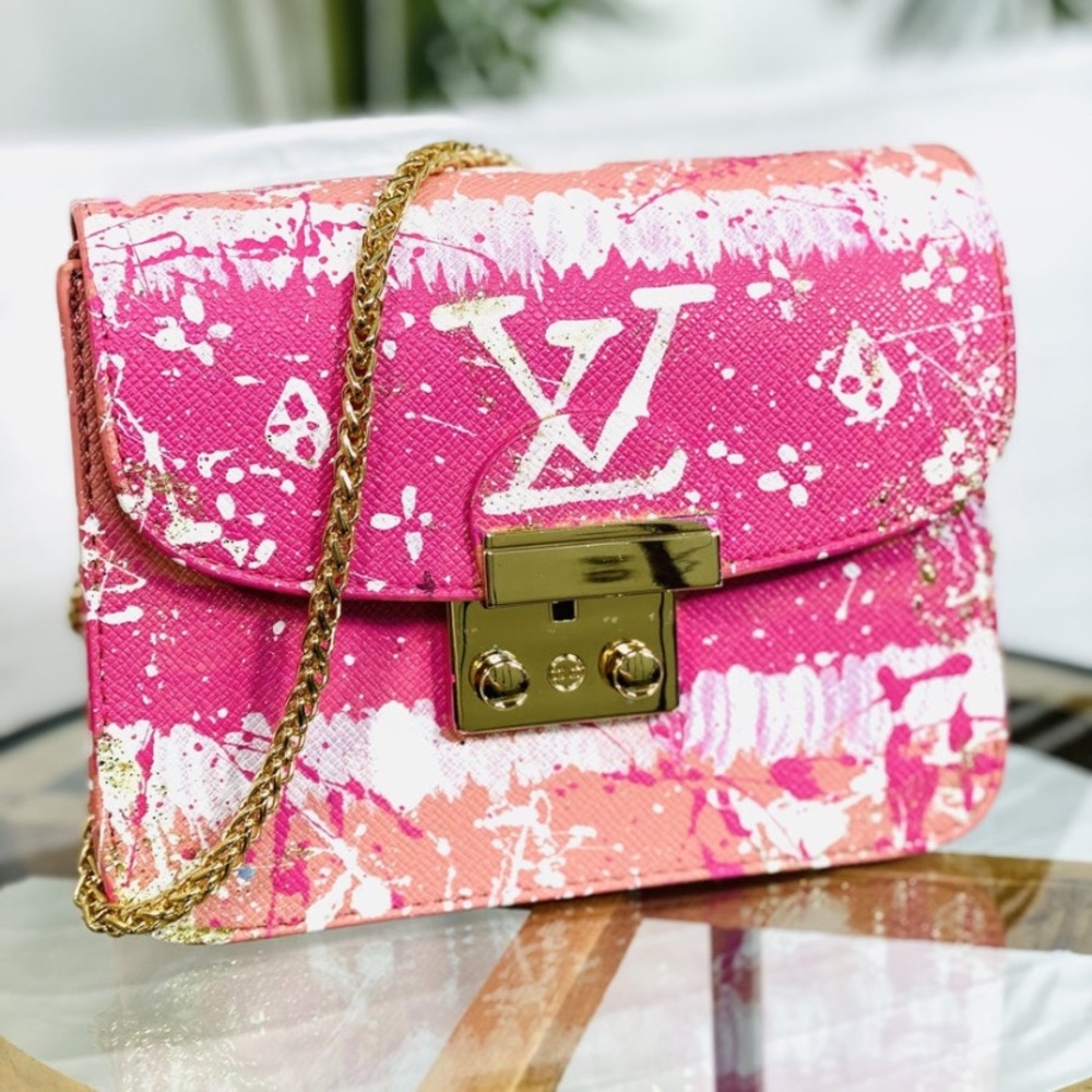new authentic anca barbu pink purse with long gold chain for strap.